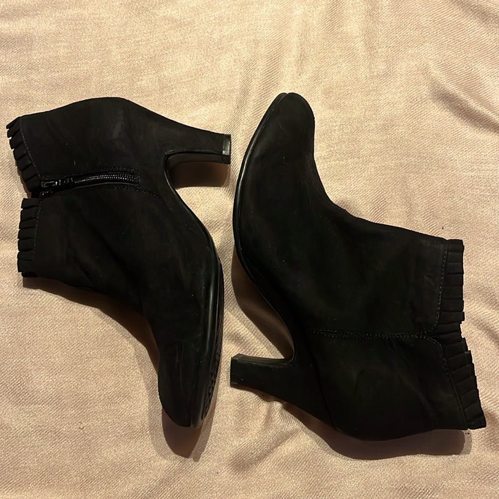 Black Ankle heeled  booties with pleated trim.